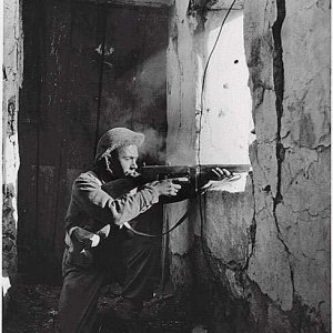 A British Tommy fires a Thompson