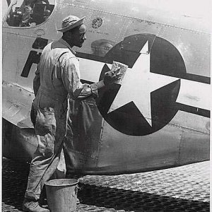 Airman cleans a P51 Mustang