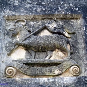 Stone carving of The Queen's Badge