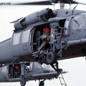 Pararescue loading onto a MH-60G Pavehawk