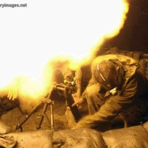 Cdn Firing a 60-mm mortar