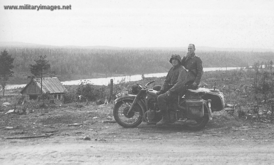 Motorcycle and men from SS-Division Nord on pause