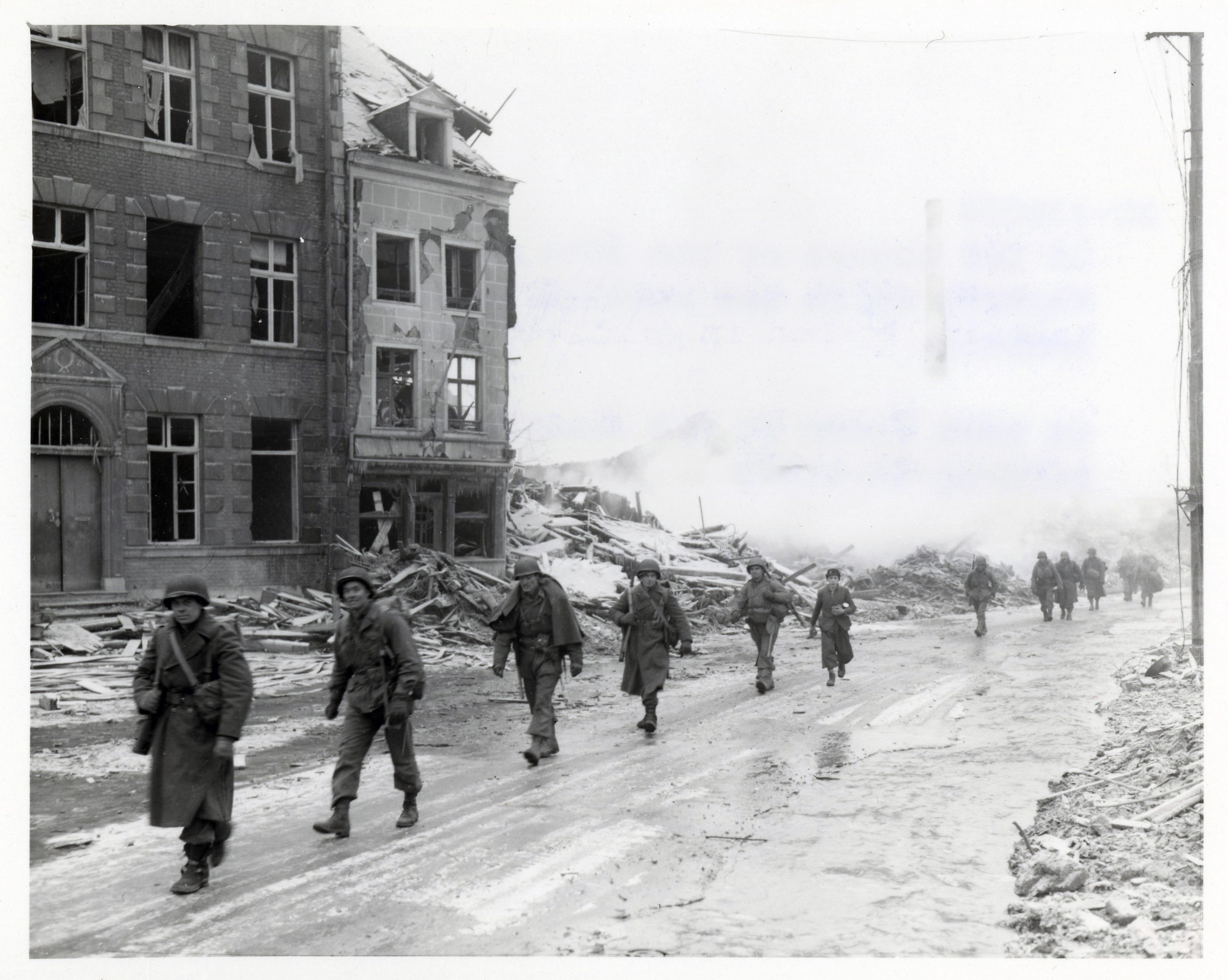 111-SC-236024_-_U.S._Inf_troops_of_the_30th_Div_on_march_through_Malmedy_which_was_leveled_in_...jpg