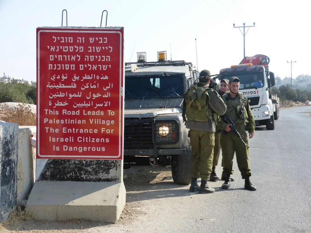 131119-tuqu-idf-with-new-warning-sign-a-morgan.jpg