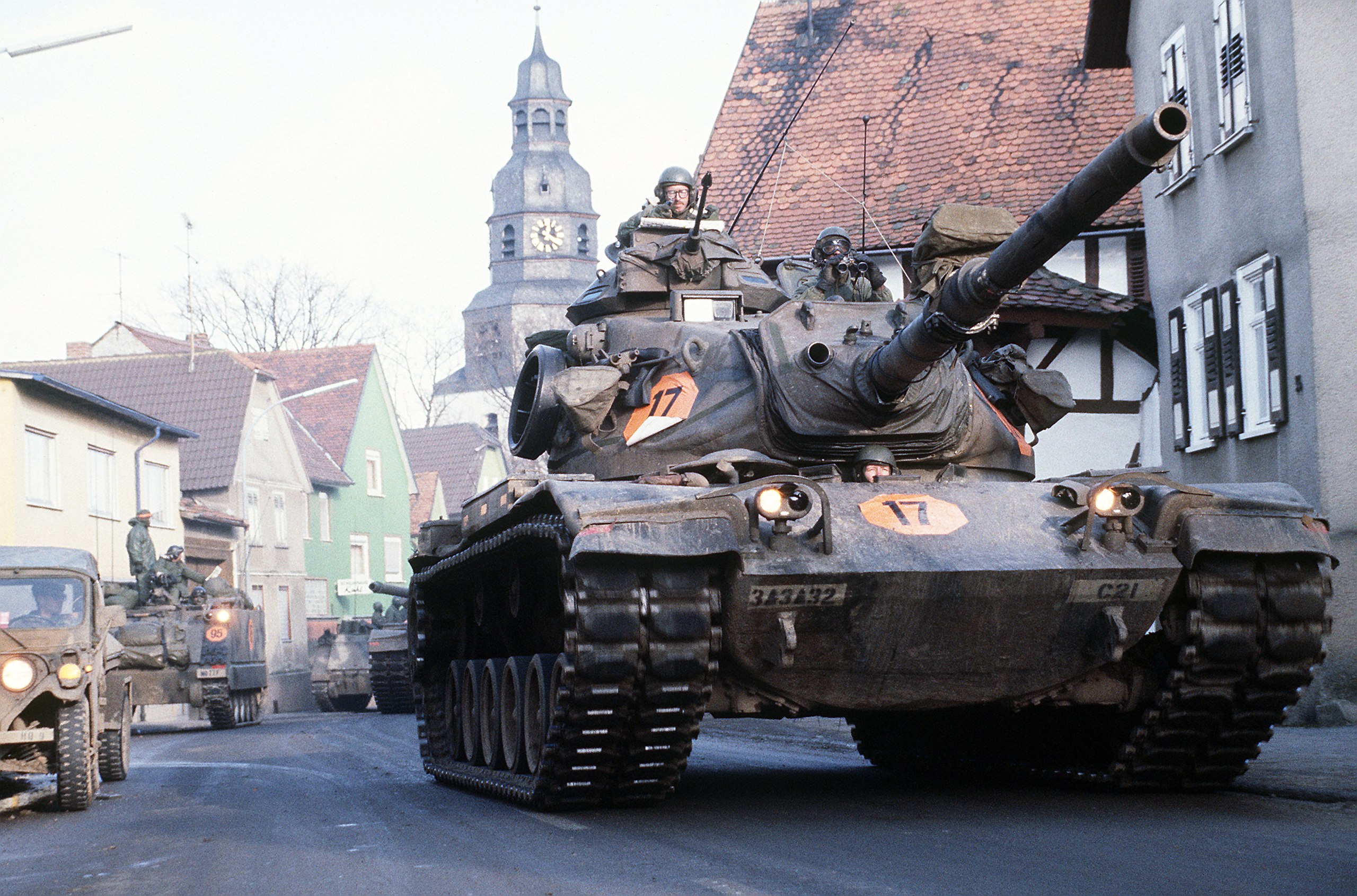 2560px-M60A3_of_3rd_Battalion,_32nd_Armor_moving_through_Langgöns_during_Central_Guardian_'85,...jpg