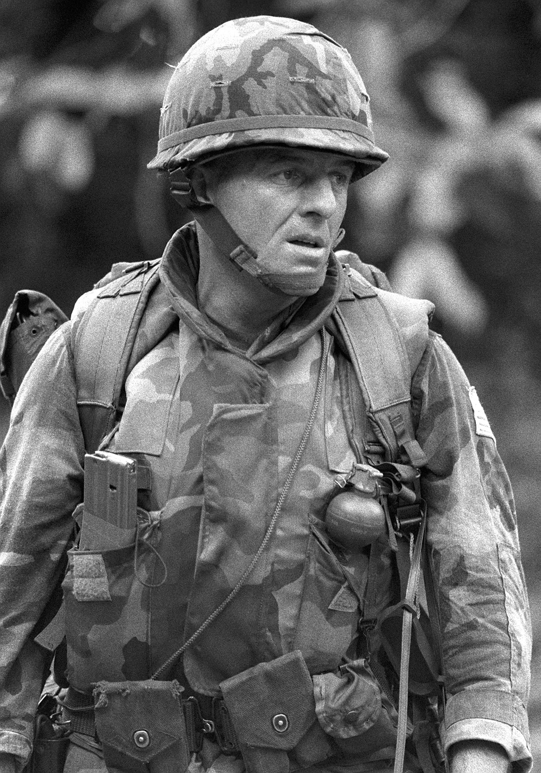 a-close-up-view-of-a-marine-as-he-patrols-the-streets-of-grenville-during-operation-e89c93.jpg