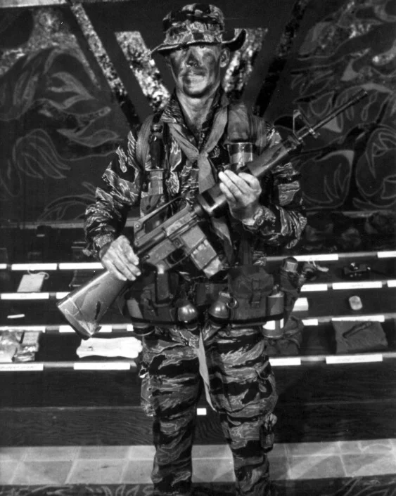 A sergeant displays standard LRRP uniform and gear during Recondo School, 1969.jpg