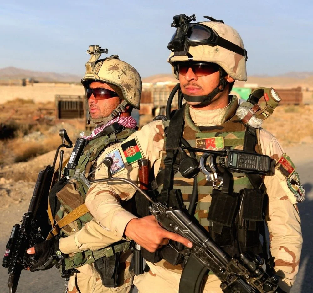 afghan-policemen-stand-guard-at-a-police-369940.jpg