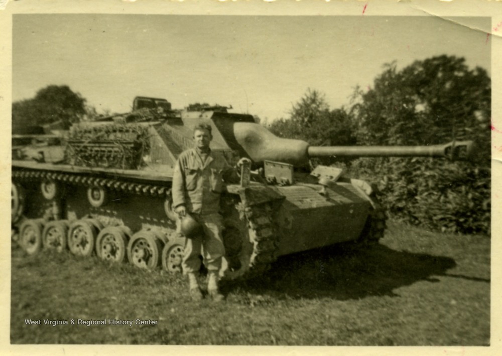 American Soldier poses with captured German AFV.jpg