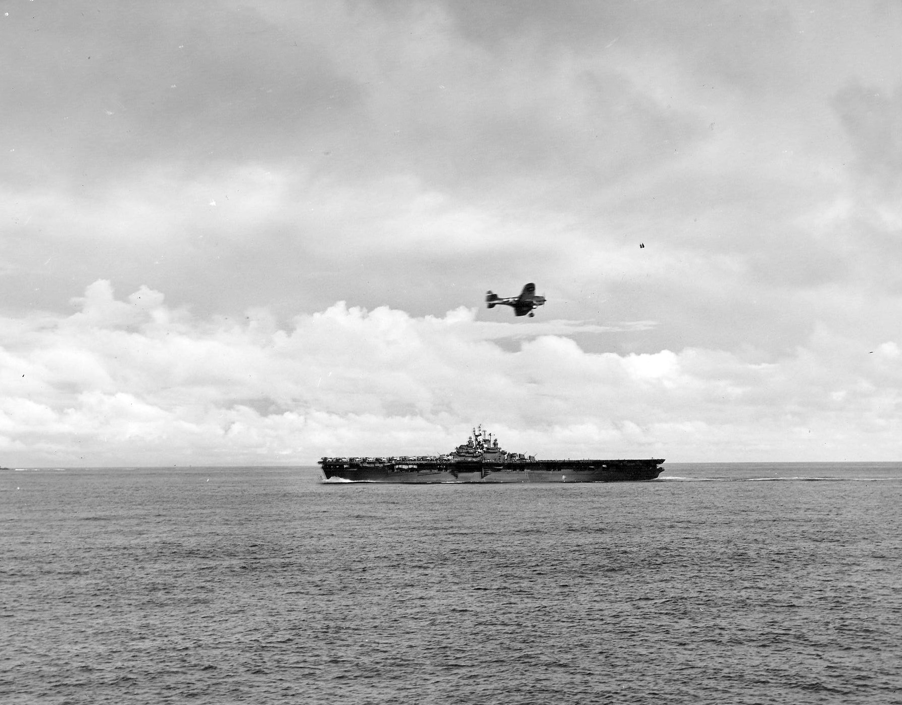An SBD Dauntless circles around to line up for a landing on board the carrier Essex (CV 9) ste...jpg