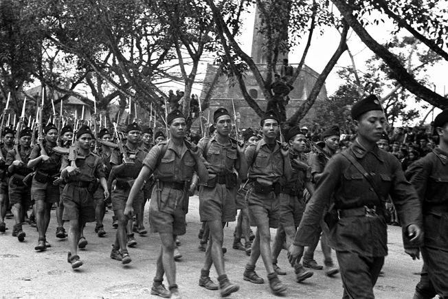 Communist soldiers loyal to Ho Chi Minh parade through the streets of Hanoi.webp