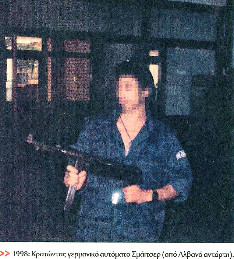 Holding a Smeicher machine gun, as a loot from the Albanian rebel he just killed (2).jpg