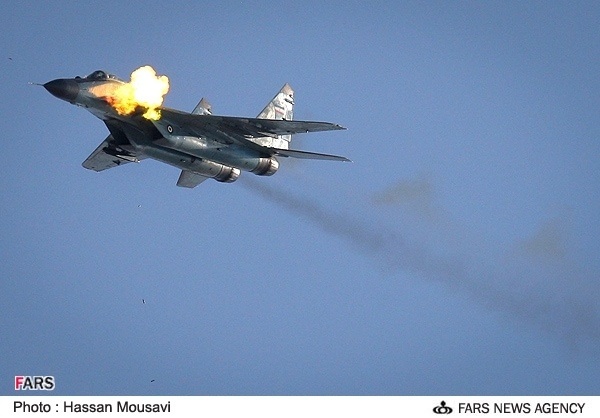IRIAF MiG-29 (9-12) firing canon.jpg