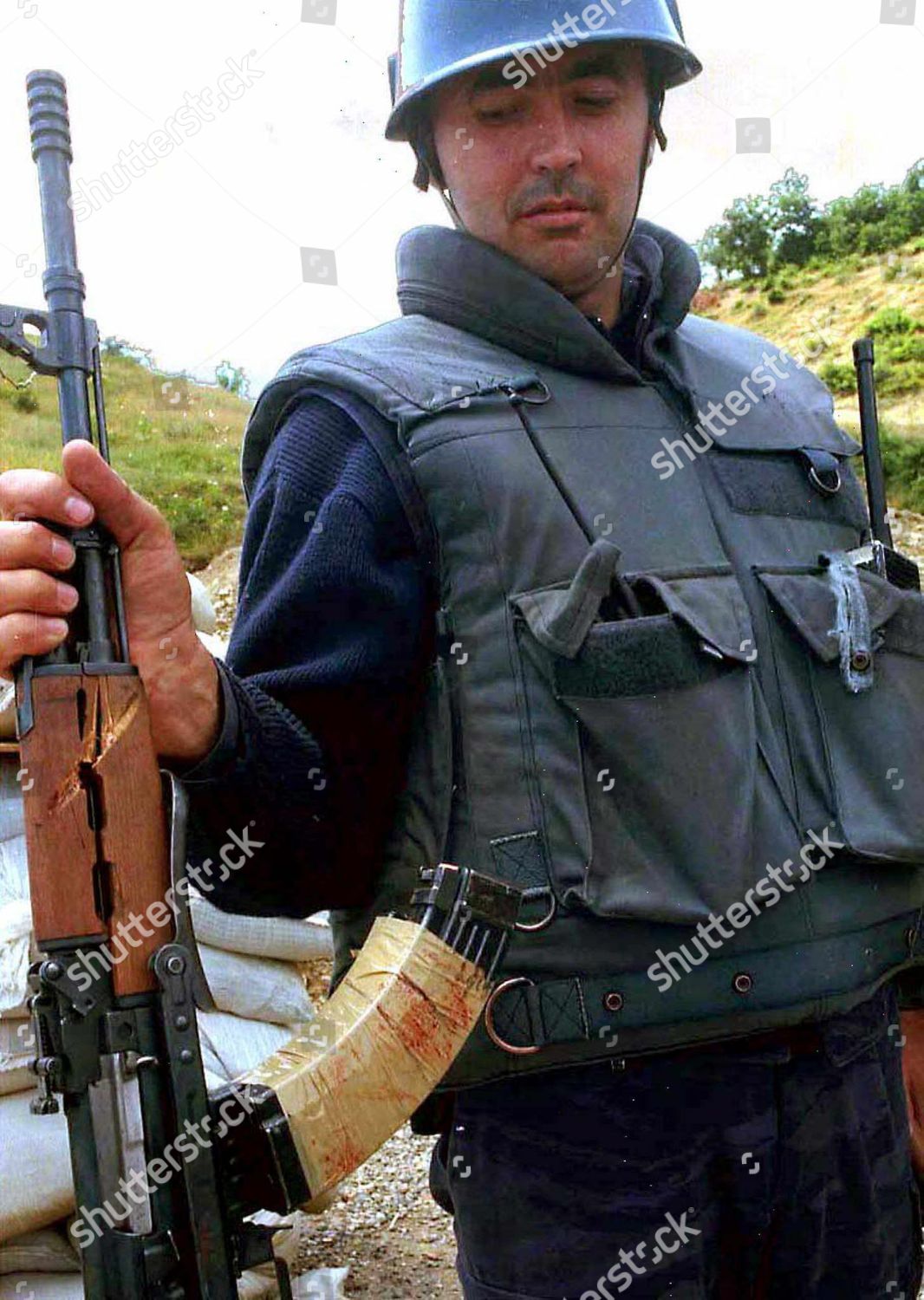 kosovo-bloodstained-gun-jul-1998-shutterstock-editorial-8794271a.jpg
