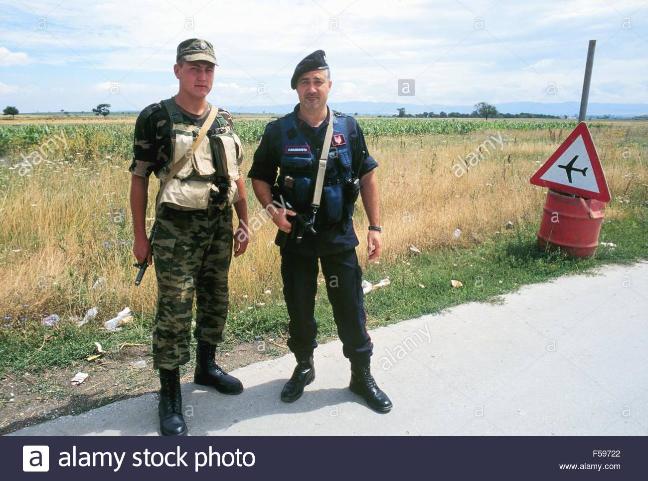 Kosovo, July 2000, Russian soldier and Italian Military Policemen garrison the entry Pristina ...jpg