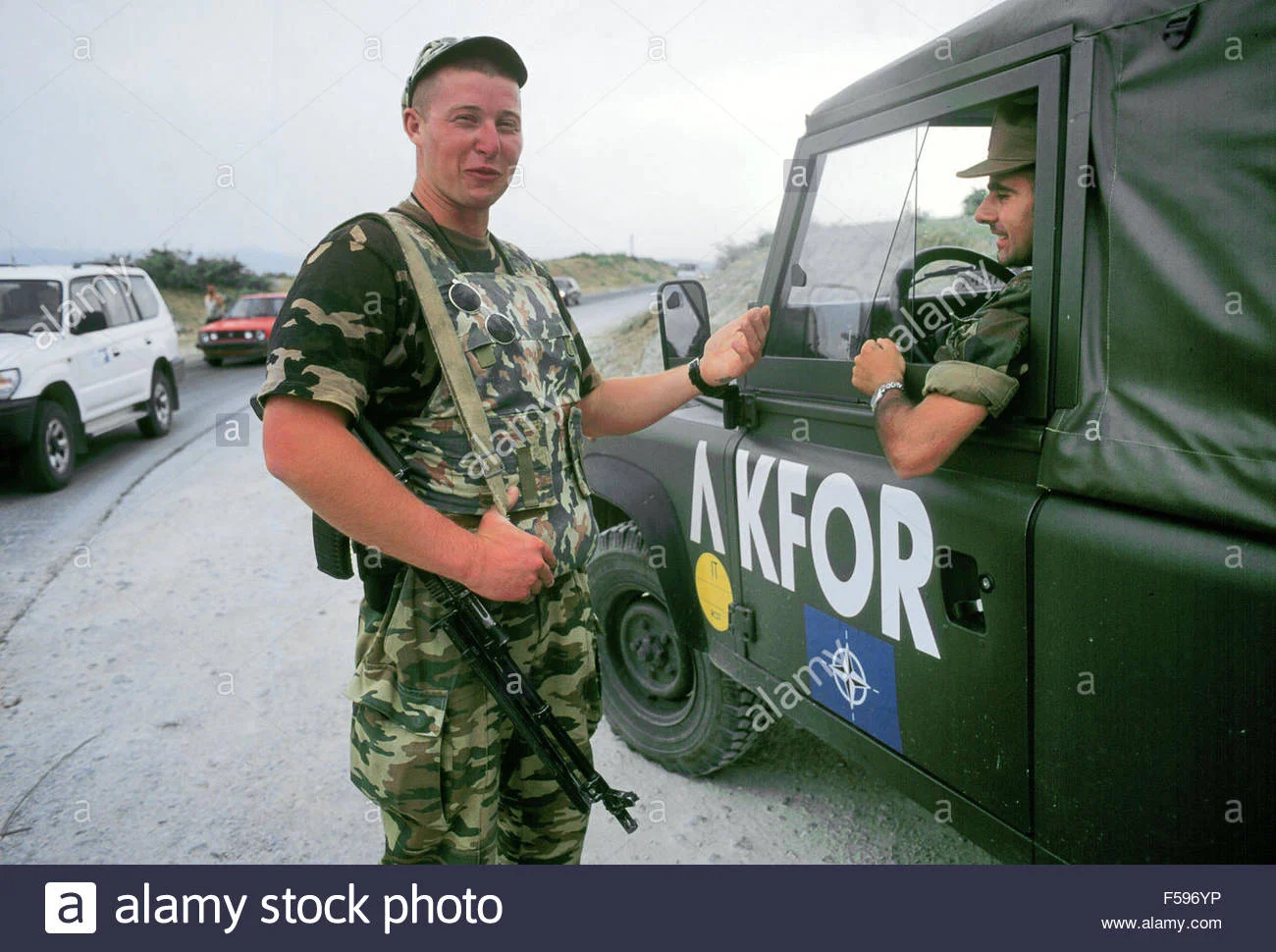 Kosovo, July 2000 Russian soldier on watch to a checkpoint on the Pristina-Pec road speaks wi...webp