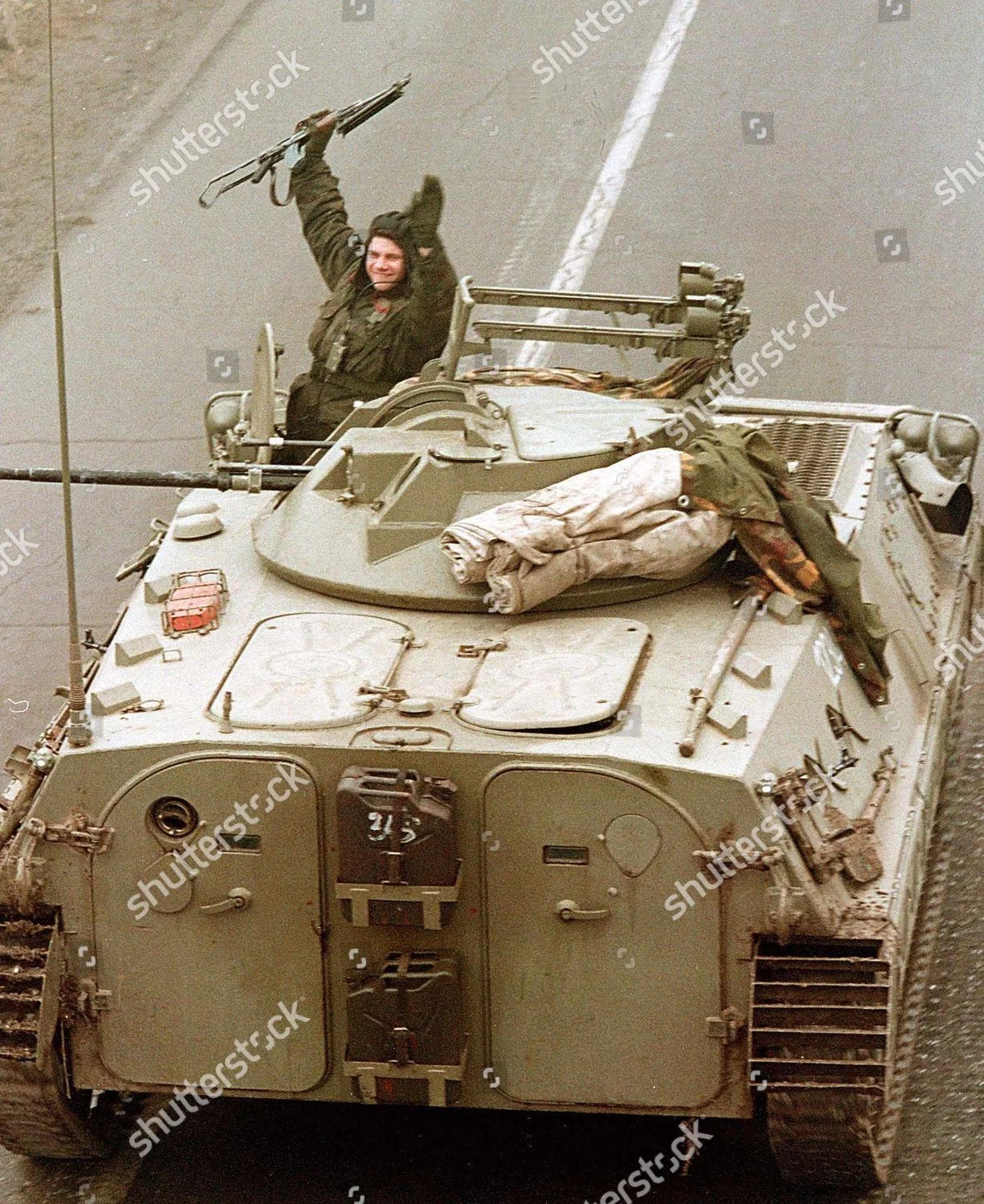 kosovo-yugo-soldiers-waves-from-apc-shutterstock-editorial-8380001a.jpg