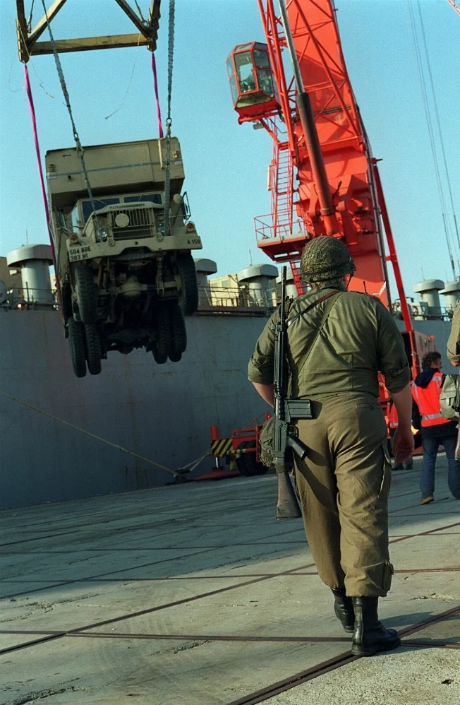 -rifle-walks-past-the-military-sealift-0cdfed-1600.webp