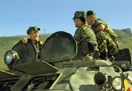 romanian sgt and spanish staff sgt on romanian apc.webp