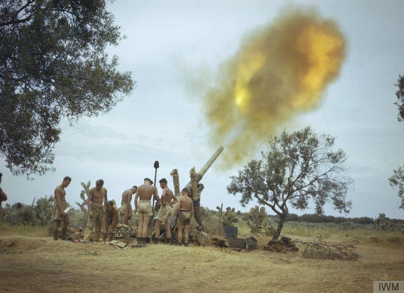 Soldiers of the British 8th Army in Tunisia fire a 4.5-inch gun four miles from the enemy line...jpg