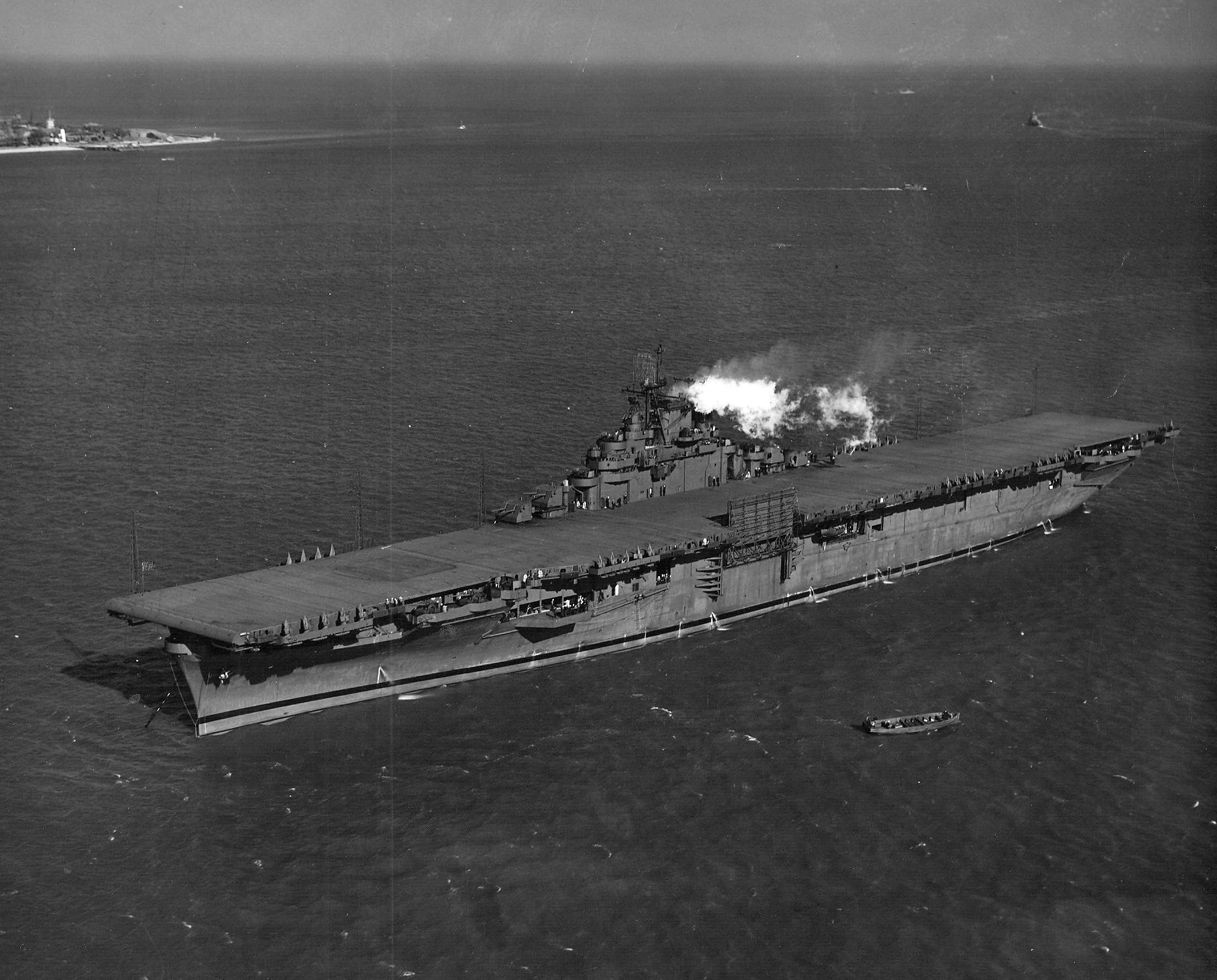 The carrier Essex (CV 9) at anchor at Hampton Roads, Virginia, shortly after her commissioning...jpg