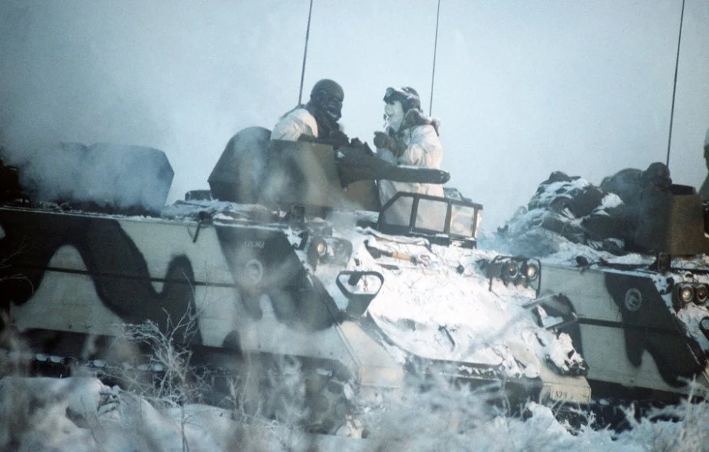 two-soldiers-stand-in-the-hatches-of-their-m113-armored-personnel-carrier-as-28bba1.webp