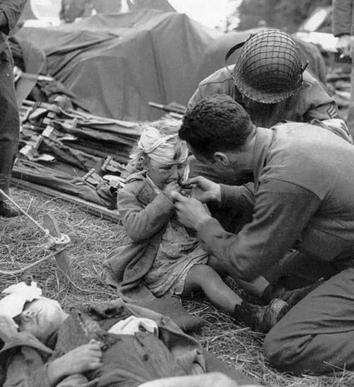 us army medics treat french child 1944.jpg