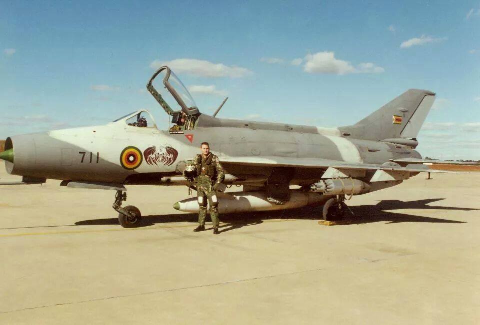 Zimbabwe F-7 (711) on ground with European pilots.jpg
