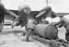 Loading_cookie_on_Mosquito_WWII_IWM_CH_12621.jpg