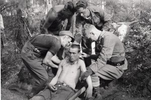 Finnish troops tending wounded Soviet soldier.jpg