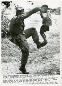 DANANG 1966 - MARINE IN VIETNAM PLAYS WITH CHILD.jpg