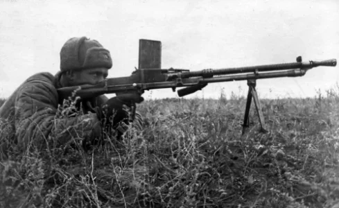 soviet senior sergeant kondrashev with a captured machinegun_ he was the first to break into ...webp