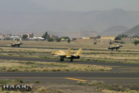 Yemeni MiG-29UB (2231) & MiG-29 (9-13) taking-off at Sanaa (September 2007).jpg