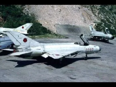 Albanian J-7 (0207 red) on ground.webp
