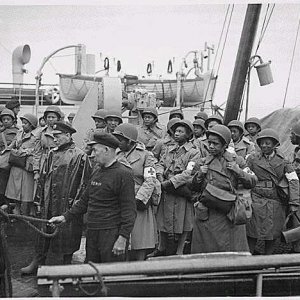 Field medics boarding a troop ship
