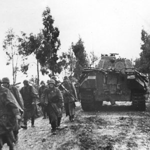 Infantry Marching On The Muddy Road Passing A Panther