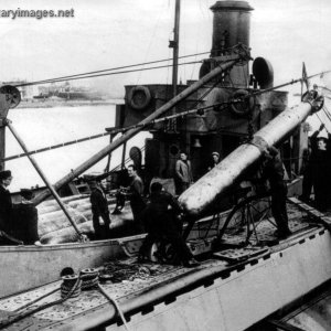 ORP Sokol loads torpedoes in the British base
