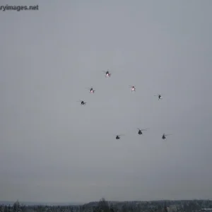 Flight of Hughes 500's & Mi-8's over Utti base
