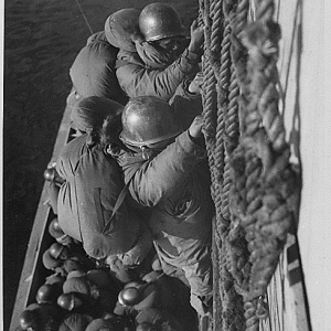 1953 January 9, Troops Are Climbing Down Cargo Net To Waitin