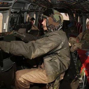 U.S. Marines go on a mission in a CH-46E Sea Knight
