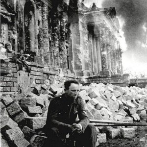 German soldier sitting in front of the burning Reichstag (1945)