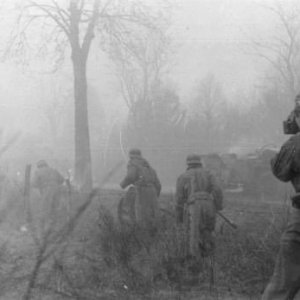 German cameraman filming advancing soldiers during the opening stages of Unternehmen Wacht am Rhein aka Battle of the Bulge (December, 1944)