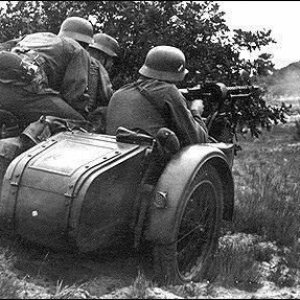 A German motorcycle reconnaissance team firing their machine gun at an enemy position