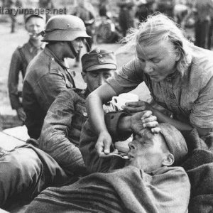 "Lotta" giving something to drink for a wounded