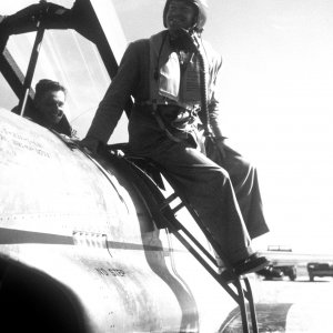 Bob Hope exits a Lockheed T-33A Shooting Star while on USO tour during The Korean War