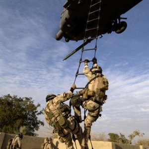 Air Force pararescuemen are extracted by a HH-60G