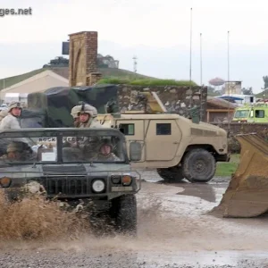 HMMWV makes its way down a flooded road