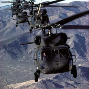 UH-60A Black Hawk string flies over mountains