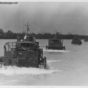 ARMORED TROOP CARRIERS IN CONVOY
