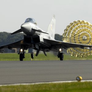 A_Typhoon_F2_fighter_jet_deploys_a_brake_parachute_as_it_lands_at_RAF_Coningsby_MOD_45147965.jpg